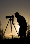 Silhouette of Steve Zmak against a setting sun.