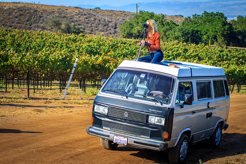 Hahn Wine Workshop - Student on top of car photographing the vineyards