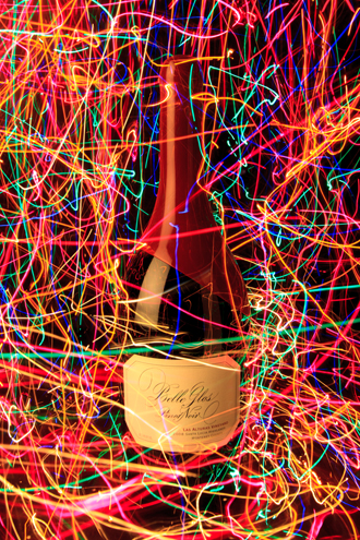Friends gave me this decorative bottle of Belle Glos SLH Pinot Noir that I had to photograph before opening it. This is a 4-second exposure with me moving handfuls of Christmas lights around the bottle like festive confetti of lights. 