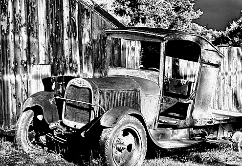 Traveling Highway 116 from Healdsburg to Jenner through the Russian River Valley, I happened upon this old truck parked just a few feet off the highway in front of a small barn. Debate still rages over it being a 1925 Ford or 1927. The tonal effect applied to this image reverses the light and dark grays while leaving the white, black and mid grays unchanged, blending the 5 tonal ranges. For Adobe Photoshop users this is called a Z-Curve in the Curves dialog box. 