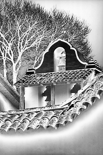 A surreal look at a California mission. The tonal effect applied to this image reverses the light and dark grays while leaving the white, black and mid grays unchanged, blending the 5 tonal ranges. For Adobe Photoshop users this is called a Z-Curve in the Curves dialog box. 