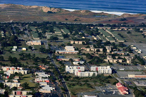 Aerial view of CSUMB and the former Fort Ord looking west over Highway 1, Fort Ord Dunes State Park, and the Monterey Bay. 