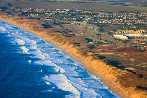 Aerial view of Fort Ord Dunes State Park, Marina State Beach, City of Marina, and Highway 1 