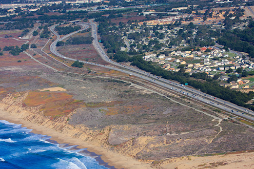 Aerial view Fort Ord Dunes State Park including Highway 1, and Seaside's military housing on the former Fort Ord. 