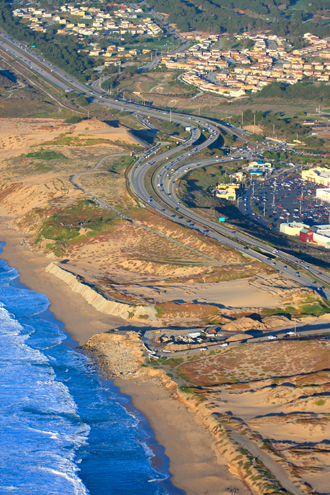 Aerial view of Sand City’s beach area and shopping center, and Highway 1. 