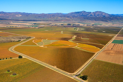 Flying between 200-1,500 feet above the famous Arroyo Seco AVA in Monterey County, this aerial photo includes the Jackson Family’s vineyards of Panorama and Clark with the intersection of Paraiso Springs Road and Clark Road in the foreground, and the Gabilan Mountains in the background. 