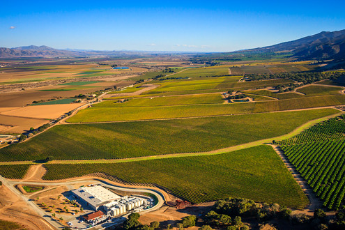 Flying between 200-1,500 feet above the famous Santa Lucia Highlands AVA in Monterey County’s Salinas Valley, this aerial photo includes Pinot Noir and Chardonnay vineyards of Mer Soleil, Sleepy Hollow, River Road, and Big Pond, and the Chalone Peaks in the distance. 