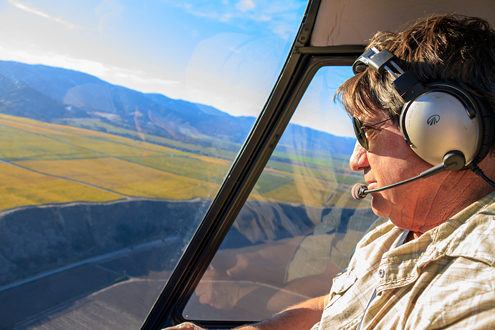 Ray Franscioni flying his helicopter over the Santa Lucia Highlands. 