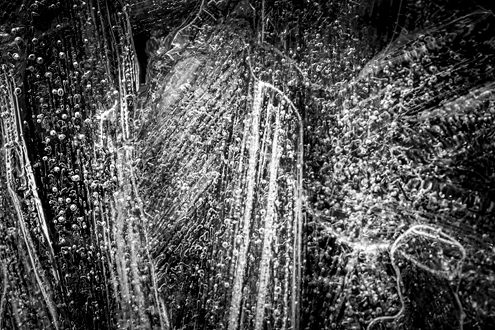Columns of ice overlap creating abstract monument-like structures from a distant world. Part of a black and white portfolio of landscape and abstract nature photographs depicting Science Fiction-like imagery from distant galaxies to Earth’s prehistoric natural history. 