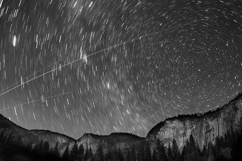 The gate to a wormhole used to travel from Earth to distant planets and back again sees a fair amount of traffic in this night sky. Part of a black and white portfolio of landscape and abstract nature photographs depicting Science Fiction-like imagery from distant galaxies to Earth’s prehistoric natural history. Also available in color. 