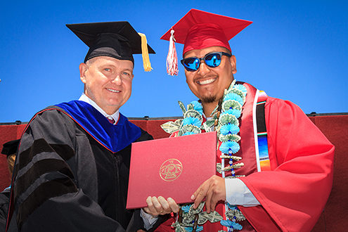 Monterey Peninsula College President Dr. Walter Tribley poses with a graduate as he hands him his diploma. I took more than 800 photos of nearly 400 graduates receiving their diplomas in about 1 hour—very faced paced event coverage. 