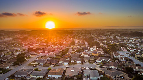 Looking west from Crescent Avenue at sunset with the Marina State Beach dunes and Monterey Bay in the background. FAA certified sUAS/Drone photography. 