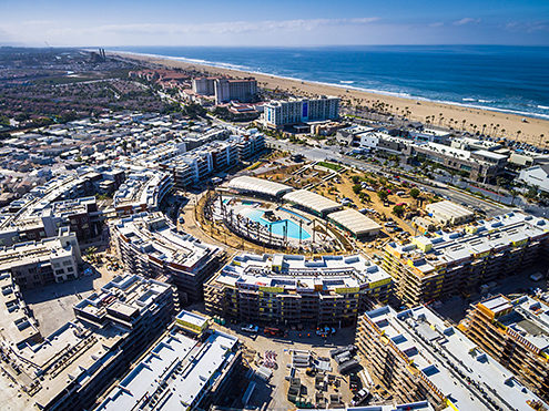 The Pacific City Apartments under construction, the Pacific City Shopping Center, and Huntington City Beach from 400 feet. FAA certified sUAS/Drone photography. 