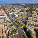 Streets, houses, apartments, and shopping centers go on endlessly. Shot with a drone camera.