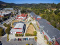 Village center shot from a drone includes apartments, theater, offices, park and art galleries.