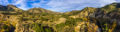 Panoramic aerial photo shot from a sUAS drone photo of the Arroyo Seco River and surrounding mountains and oak woodlands.