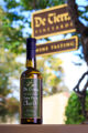 Olive oil bottle product shot with downtown Carmel-by-the-Sea background.