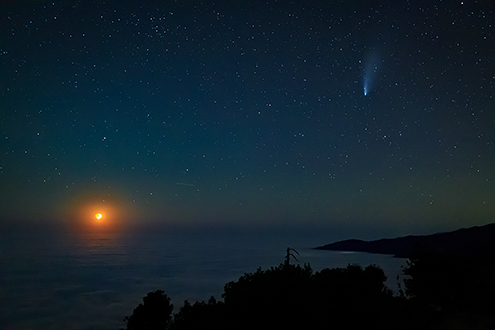 Quarter moonset over the Big Sur coast with Comet Neowise zooming by on Thursday, July 23, 2020 from about 3000 feet above sea level. That's not the ocean, it's the top of the fog layer blocking all the beach campers from getting to see this. The little bright spot at the edge of the coast directly below the comet are the lights of Lucia glowing below the fog. PRINT SALE INQUIRIES: Art WeMe Contemporary Gallery, ArtWeMe@yahoo.com, ArtWeMe.com, Mission Street Between 5th & 6th Avenue, Carmel-by-the-Sea, CA 